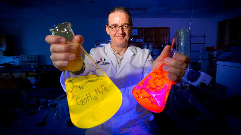  Françisco Raymo poses in his lab with the fluorescent molecules he developed. Photo: Joshua Prezant/University of Miami 