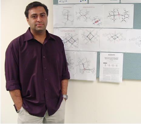 Professor Captain standing next to the board with chemical formula